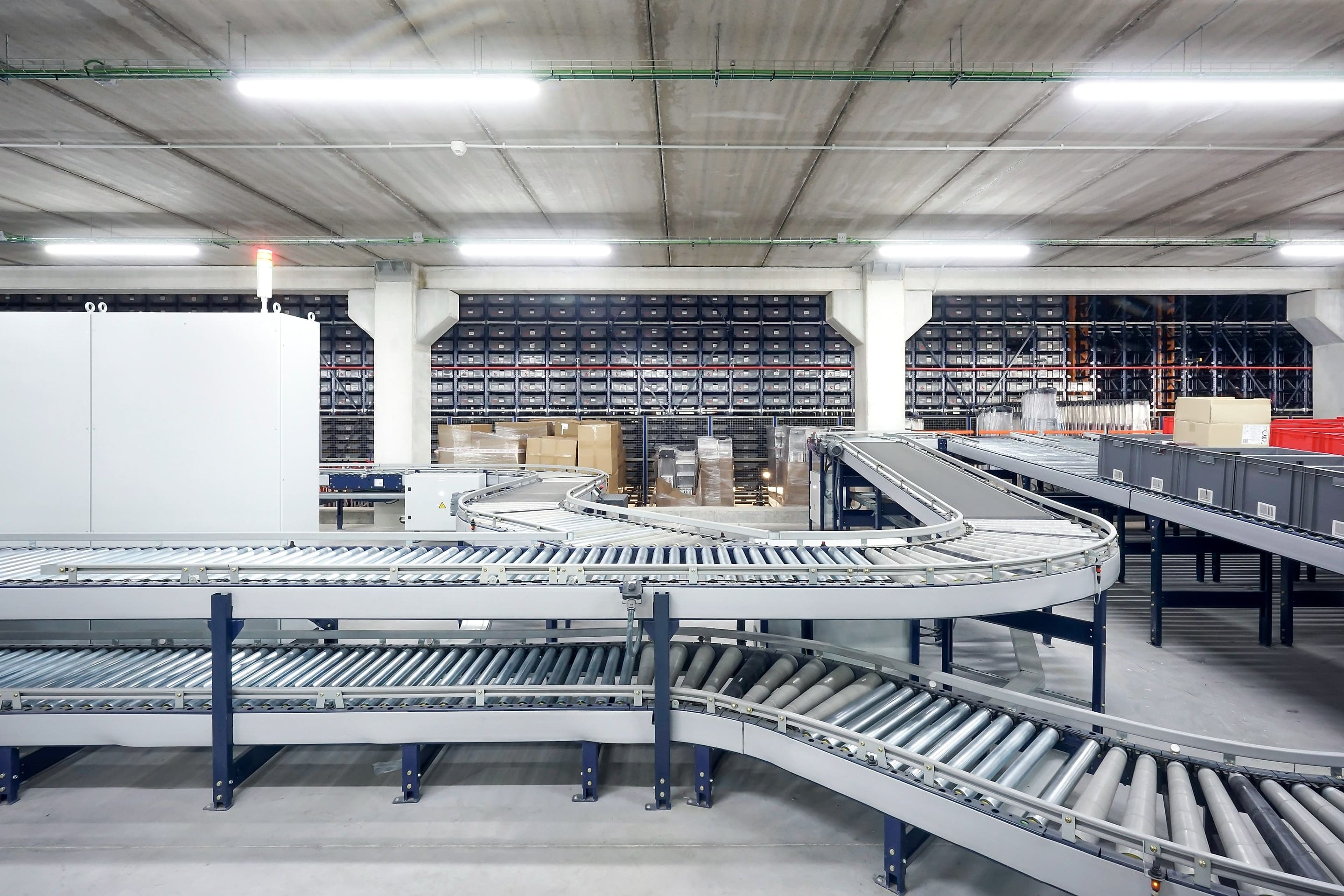 Cartons moving along a conveyor in a warehouse